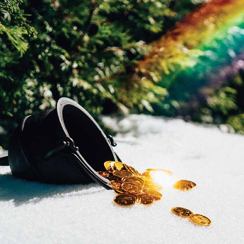 Shamrock1 Gold coins spilling out of a black cauldron with a rainbow.