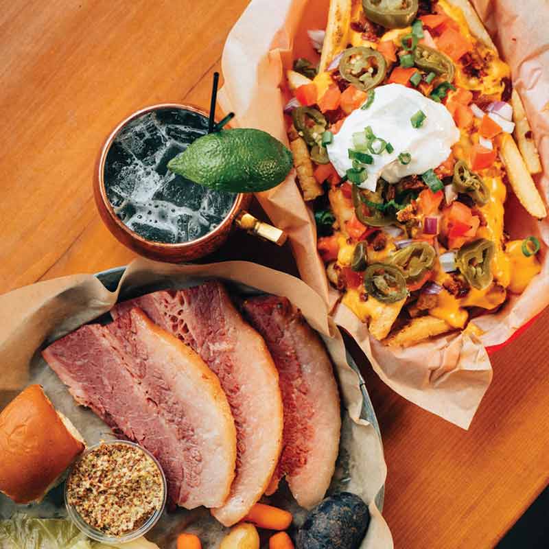 Shamrock2 Shamrocks and Shenanigans food specials: Corned beef, Irish nachos, and a cold drink with a lime wedge.